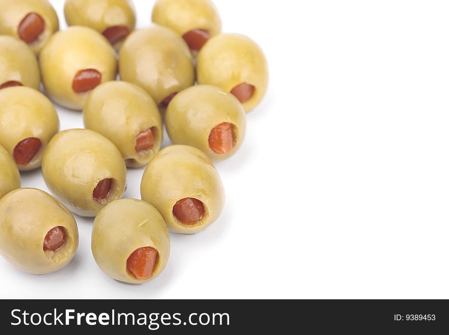 Pepper stuffed olives isolated over white background