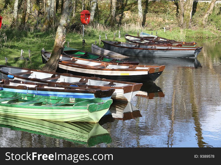 Small channel of the river, boats are waiting for irish fishermen. Small channel of the river, boats are waiting for irish fishermen