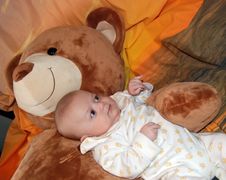 Infant Baby Boy With Bear Stock Photo