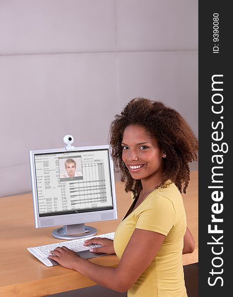 Portrait of female student working on computer.
