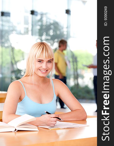 Portrait of female student smiling at camera.