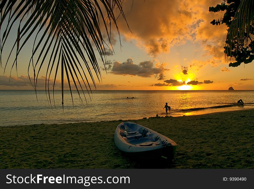 Canoe at sunset,  on a beauiful Caribbean beach