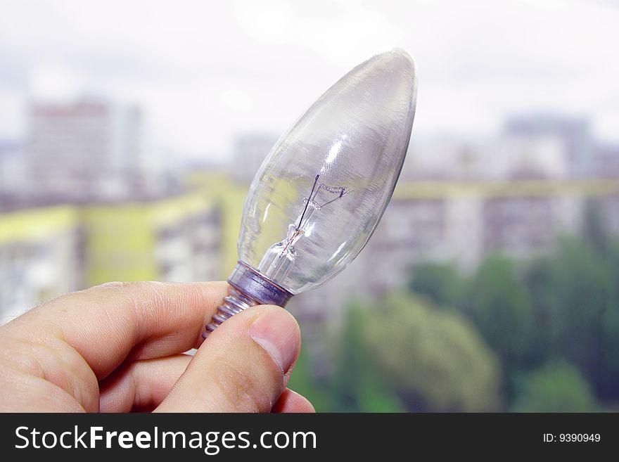 Hand holding a light bulb. Hand holding a light bulb