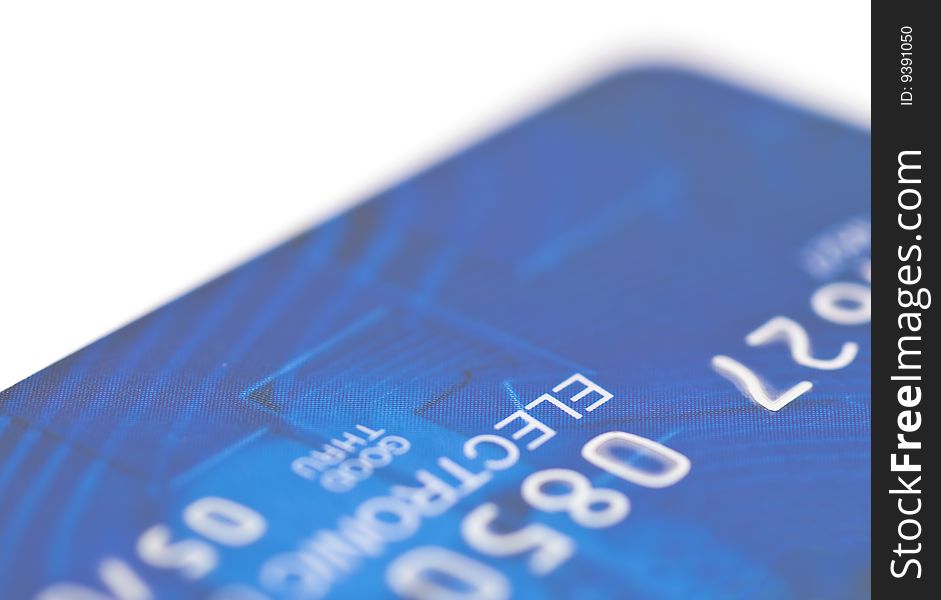 Fragment of a plastic credit card on a white background