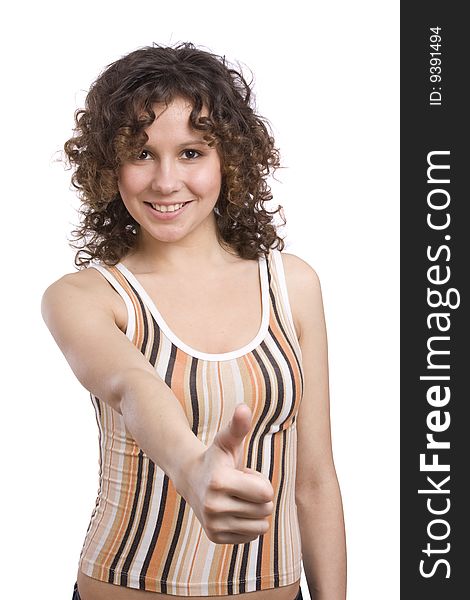 Girl showing thumbs up on white background. Woman looking into the camera while giving an ok gesture with her forward hand. Happiness woman shows OK. Happy young girl with thumb's up sign against isolated white background. Girl showing thumbs up on white background. Woman looking into the camera while giving an ok gesture with her forward hand. Happiness woman shows OK. Happy young girl with thumb's up sign against isolated white background.