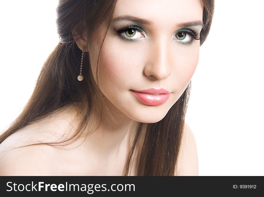 Beautiful young brunette with bright makeup isolated on white background