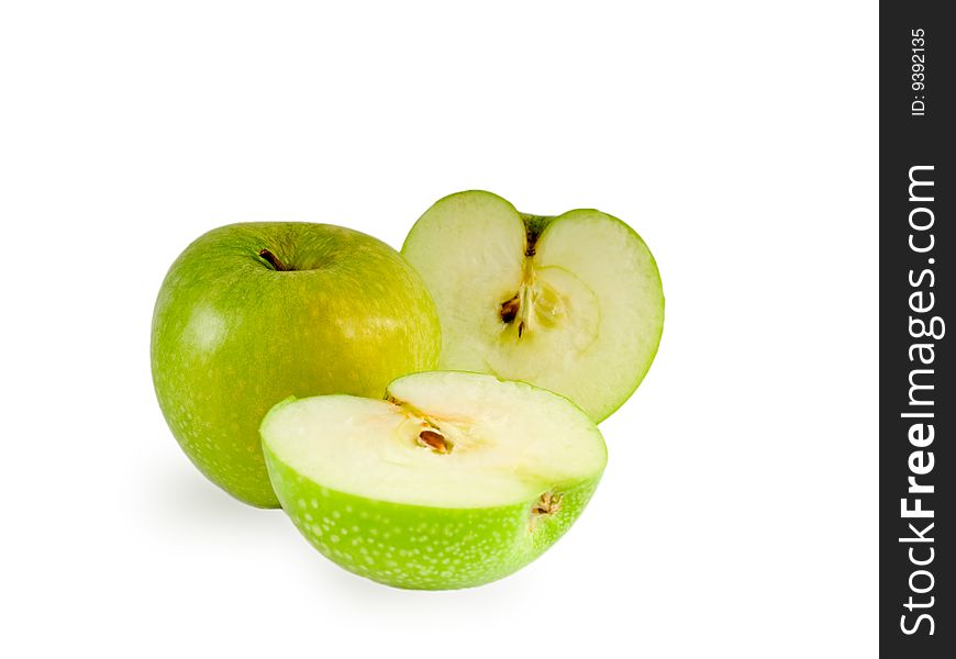 A green crunchy Granny Smith apple with two half. A green crunchy Granny Smith apple with two half