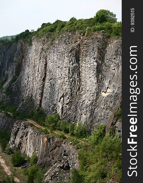 One of the chalky quarries near Morina village and Karlstejn castle in The Czech republic. This region is called Czech Grand Canyon, iit is very popular place for tourists, tramps and filmers. The querry on the picture is called Big America, there is its cliff.