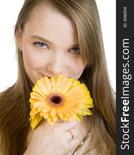 Smiling girl with yellow flowers on white background. Smiling girl with yellow flowers on white background