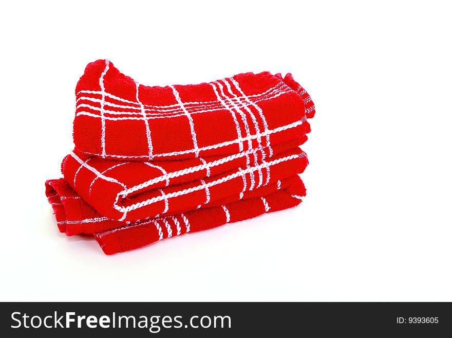 Stack of red towels on a white background