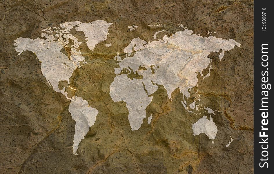 A image of a world map on a textured background like a grunge rock. A image of a world map on a textured background like a grunge rock.