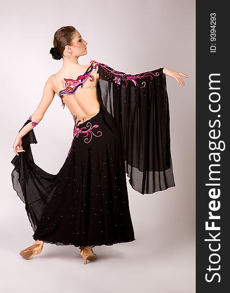 Professional dancer, studio shot over light background