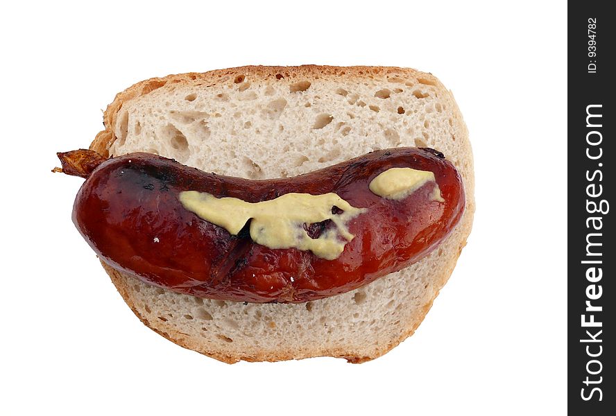 Grilled sausage with mustard on bread - isolated