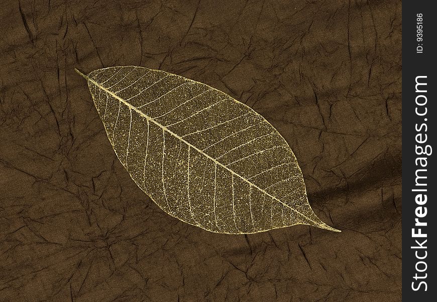 Gold leaf skeleton over silk background. Gold leaf skeleton over silk background