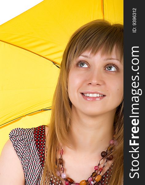 Cute young woman with yellow umbrella on white background