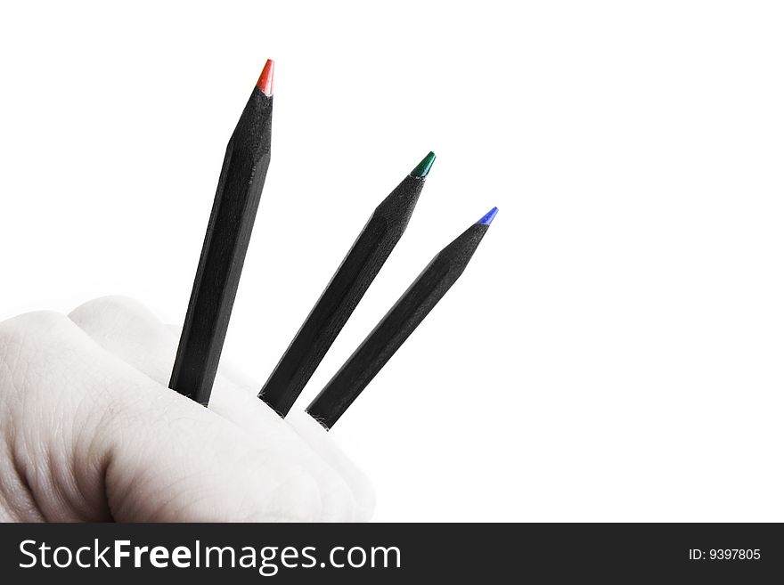 Feel creative power - fist holding sharp color pencils concept. Feel creative power - fist holding sharp color pencils concept