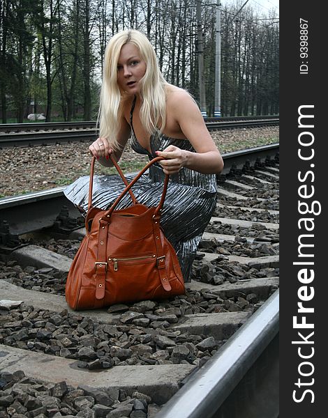 Funny girl with a bag traveling