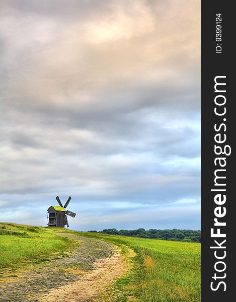 The ancient windmill in the Ukrainian ethnographic museum near Kiev. The ancient windmill in the Ukrainian ethnographic museum near Kiev