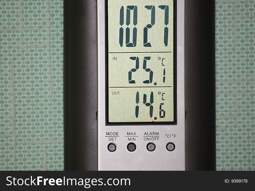 This is an electronic clock and thermometer.