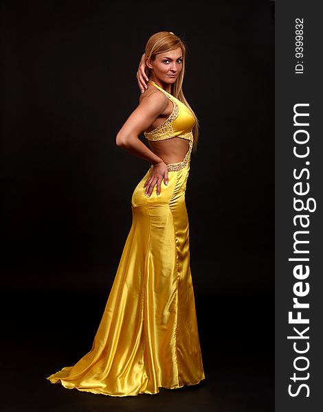 Fitness woman posing in evening- dress. Fitness woman posing in evening- dress