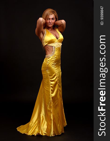 Fitness woman posing in evening- dress. Fitness woman posing in evening- dress