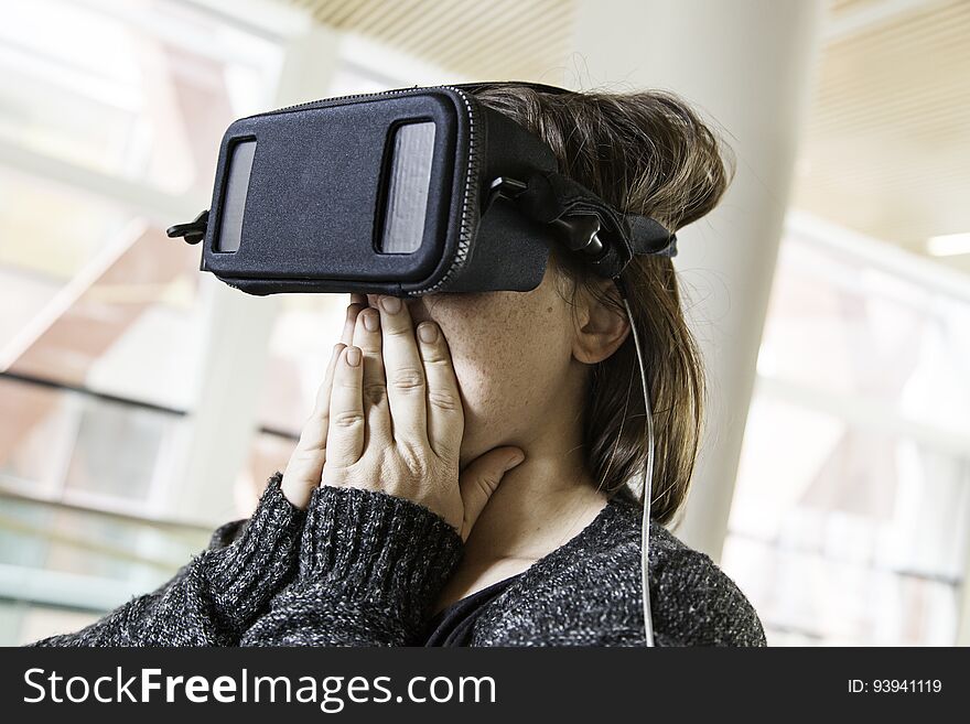 Woman with virtual reality glasses playing, technology and entertainment. Woman with virtual reality glasses playing, technology and entertainment