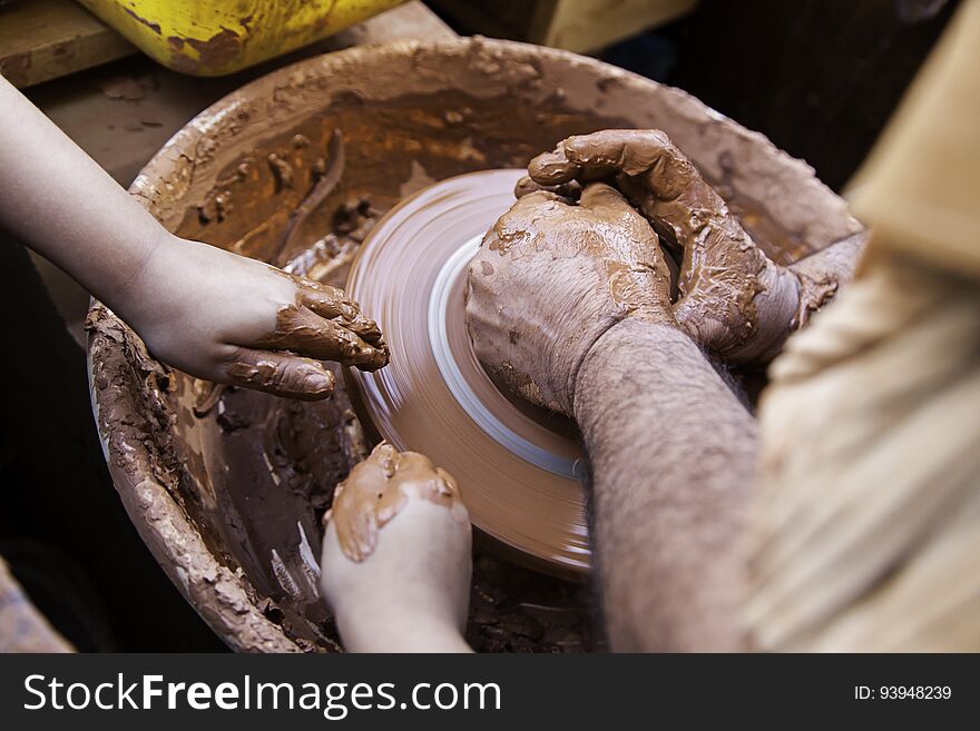 Person working with clay, detail of craftsmanship, craftsmanship in clay, potter