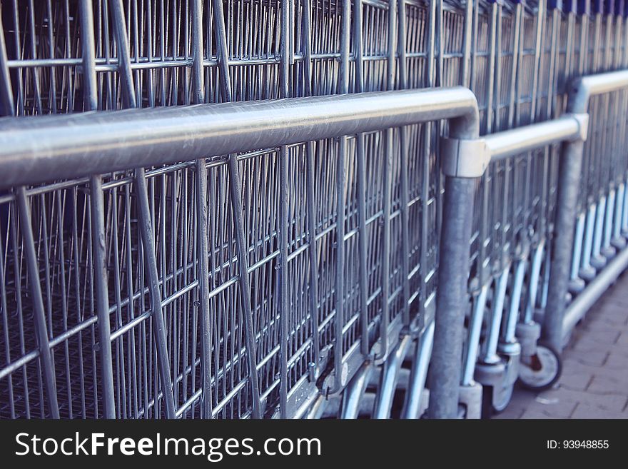 Closeup of shopping carts stacked together.