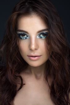 Close-up Portrait Of Girl With Dark Hair With Blue Eyeshadow And Silver Dots, Looking At The Camera Stock Photos Close-up Portrait Of Girl With Dark Hair With Blue Eyeshadow And Silver Dots, Looking At The Camera Stock Photos