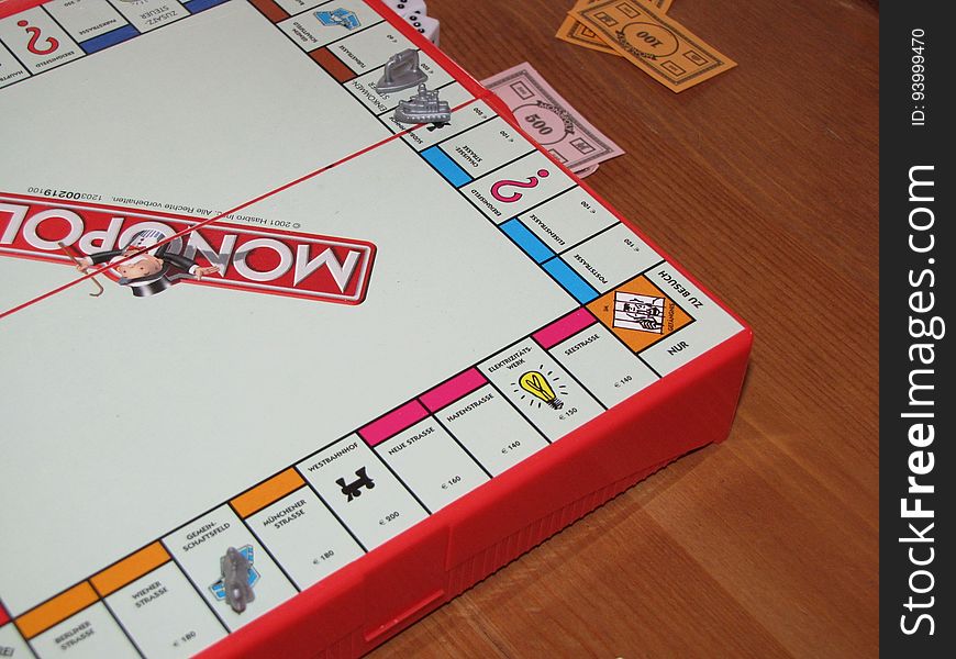 A game of Monopoly on table.