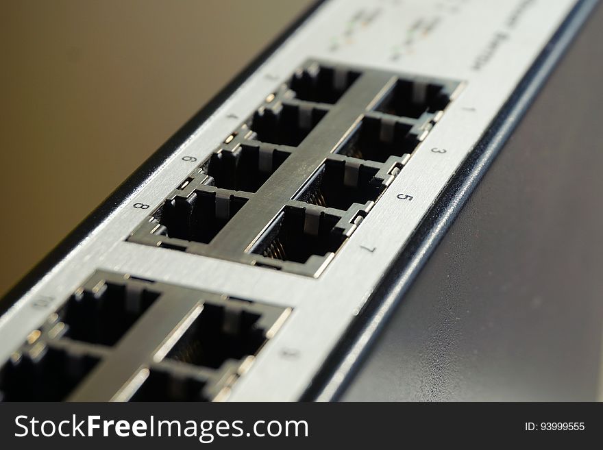 Black and White Lan Port Router in Shallow Focus Photography