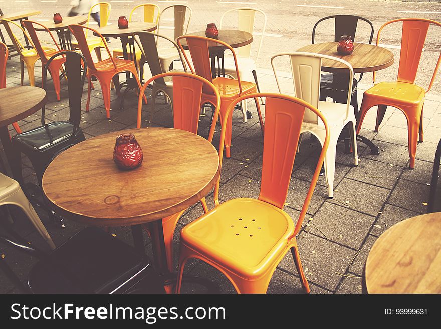 Empty table and chairs in outdoor cafe on sunny day. Empty table and chairs in outdoor cafe on sunny day.