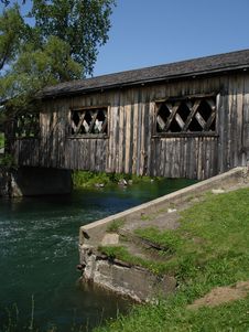Wooden Bridge Through The River Royalty Free Stock Image