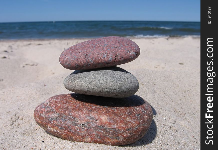 Three stones on the beach