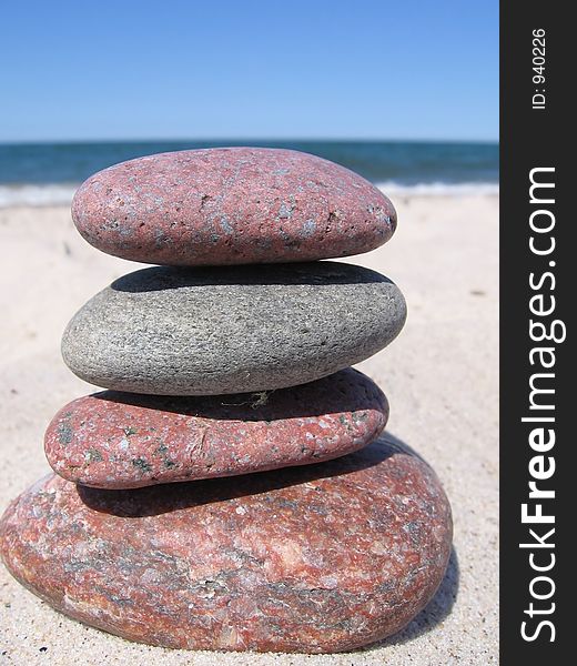 Four stones on the beach