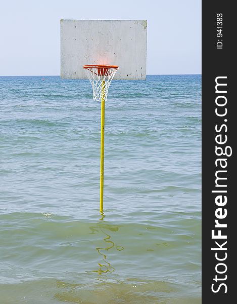 A basket ball in the sea in italy. A basket ball in the sea in italy