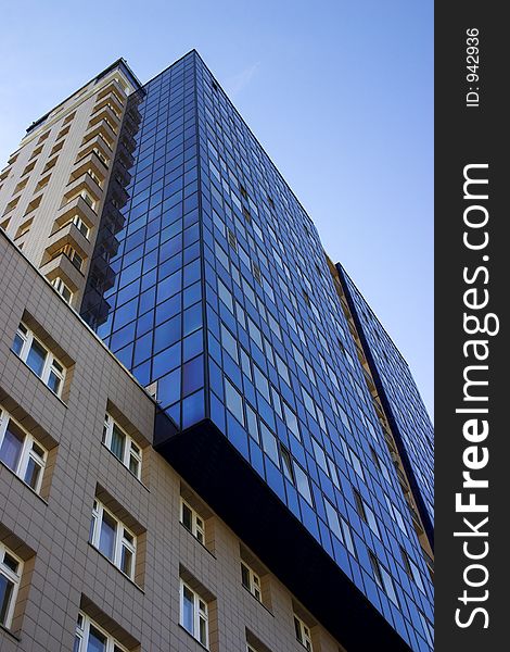 Skyscraper from a dark blue glass. Skyscraper from a dark blue glass