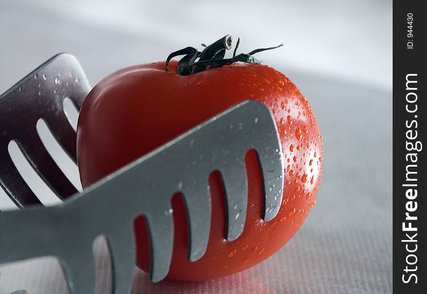 Tomato And Tongs