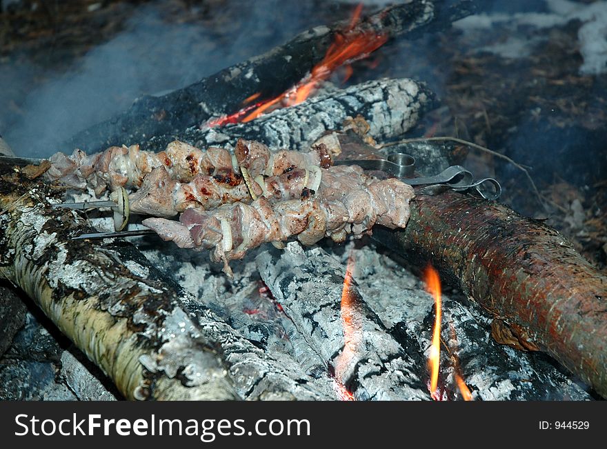 Grilled pork on bonfire