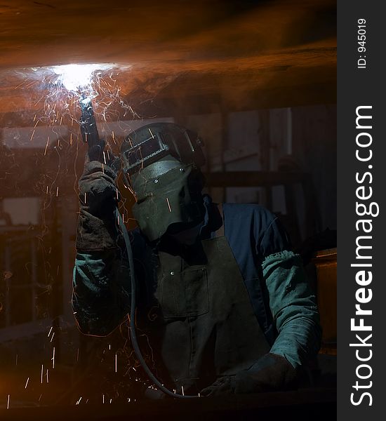 Welder under ship working. Welder under ship working