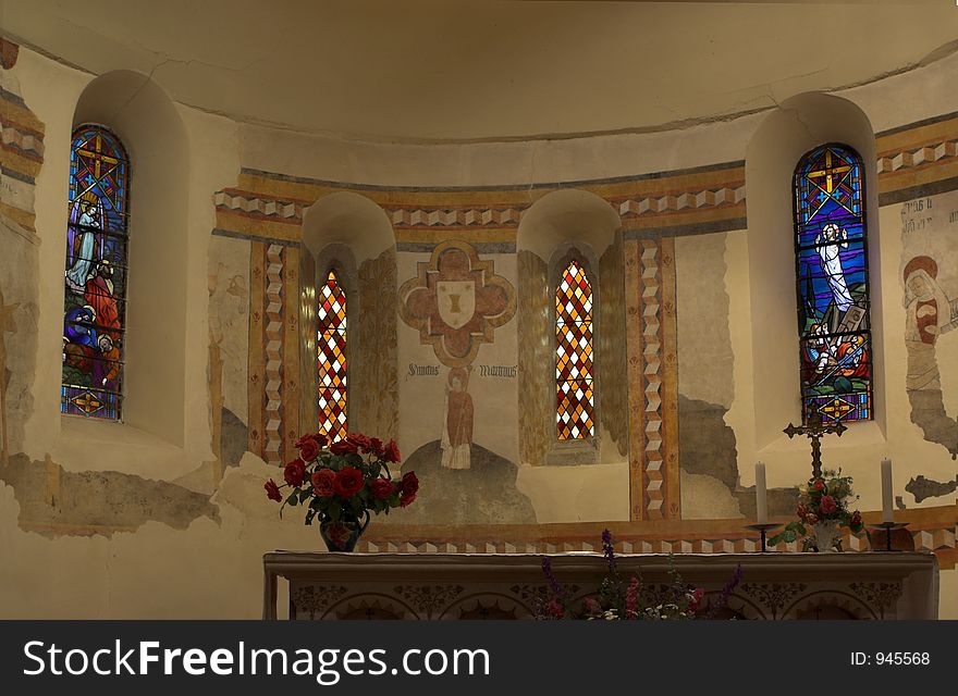 Stained glass behind a church altar in Southern France