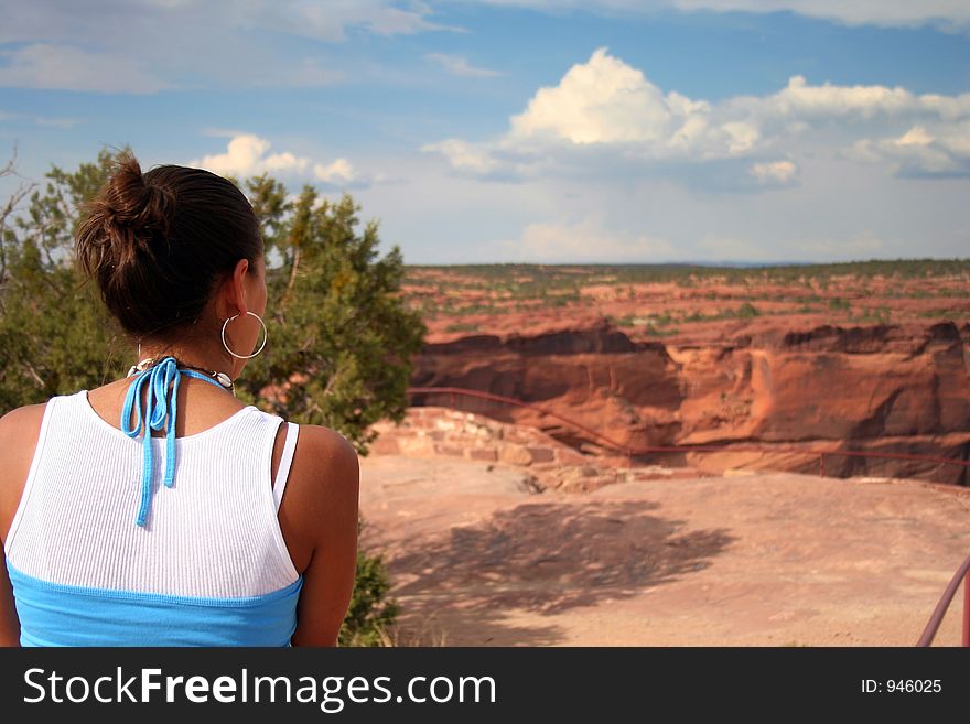 A beautiful young native American woman gazing at the southwestern landscape. A beautiful young native American woman gazing at the southwestern landscape