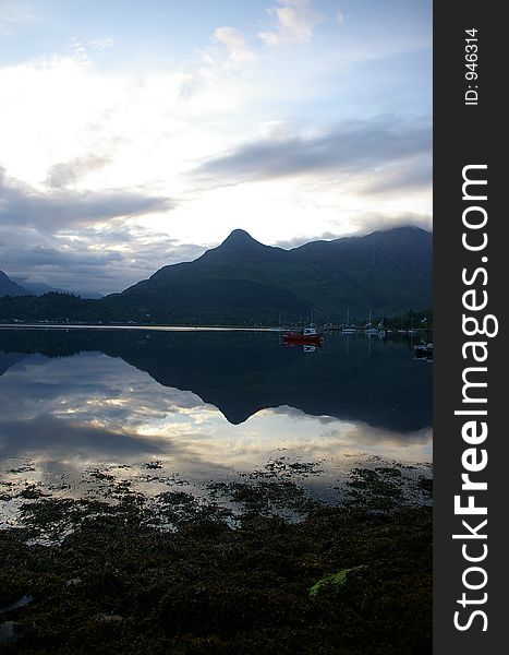 An early 4:00 AM sunrise on Loch Lomond in the west highlands of scotland. An early 4:00 AM sunrise on Loch Lomond in the west highlands of scotland