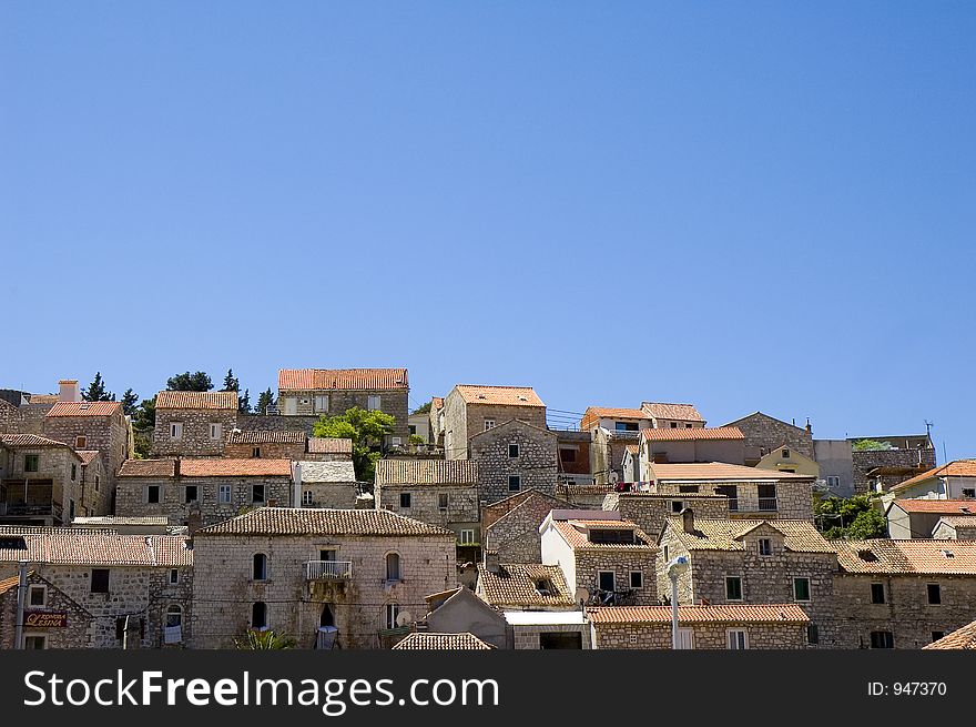 Houses set on a hill on the Island of Hvar off the coast of Croatia. Houses set on a hill on the Island of Hvar off the coast of Croatia