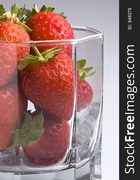 Strawberries in a glass tumbler. Strawberries in a glass tumbler