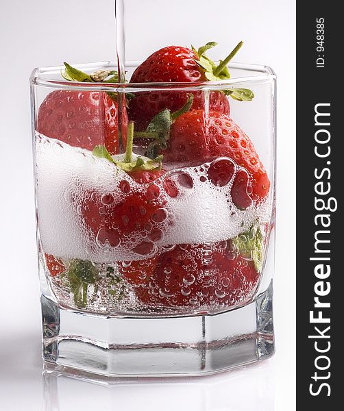 Fizzy strawberries in a glass