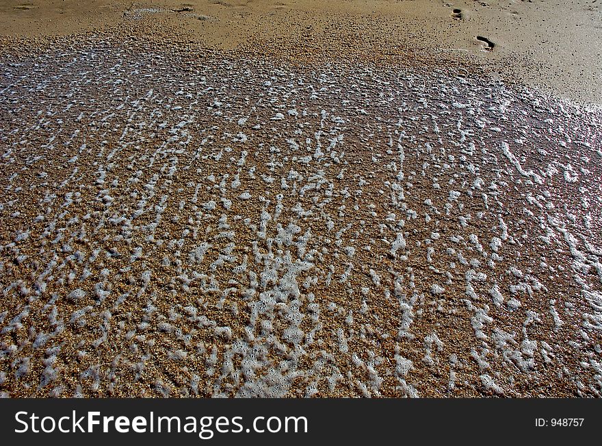 Footprints on wet sand. Footprints on wet sand