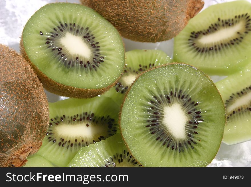 Delicious ripe kiwi fruit sliced open. Delicious ripe kiwi fruit sliced open.