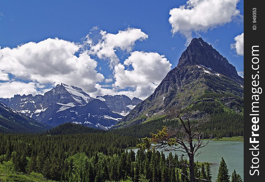 This picture was taken in the Many Glacier area of Glacier National Park and shows a portion of Swiftcurrent Lake and Mt Gould in the far background. This picture was taken in the Many Glacier area of Glacier National Park and shows a portion of Swiftcurrent Lake and Mt Gould in the far background.