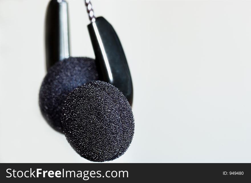 Black earphones with white background